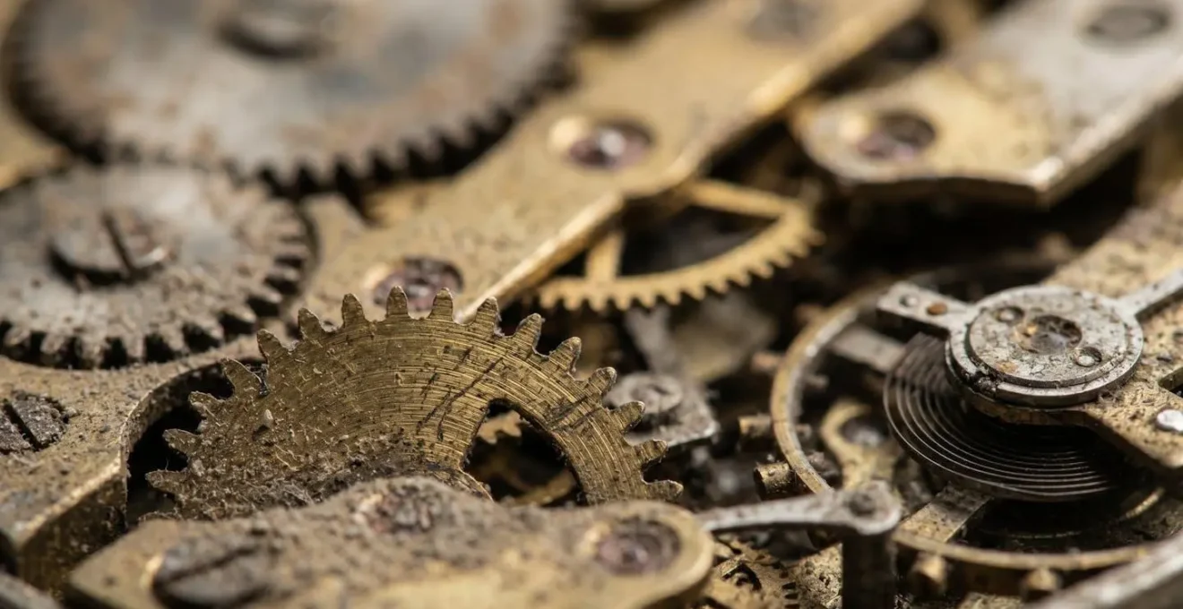 A macro photograph of dusty clock gears, symbolizing the financial inertia and missed opportunities of a savings account left to languish at a poor rate.