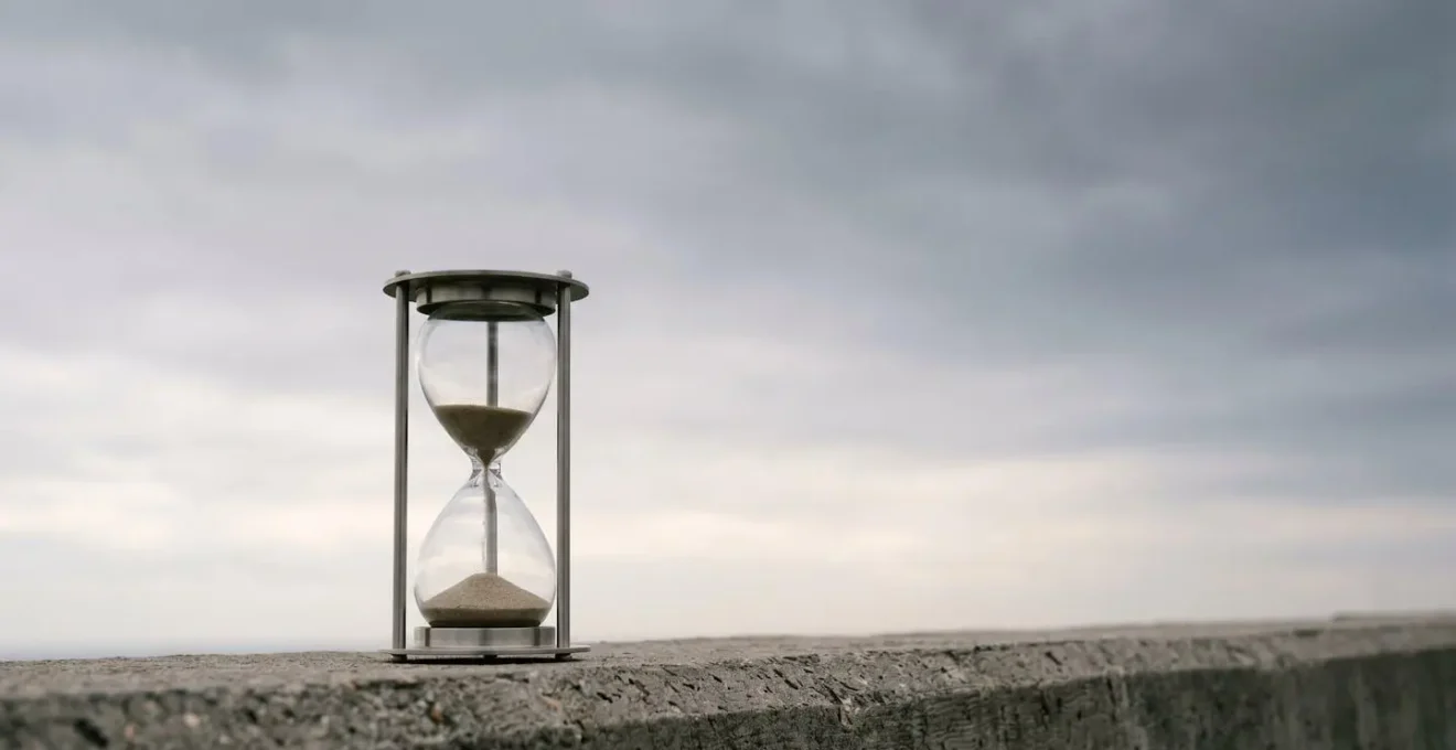 Minimalist wide shot depicting the concept of value erosion and time passage in investments