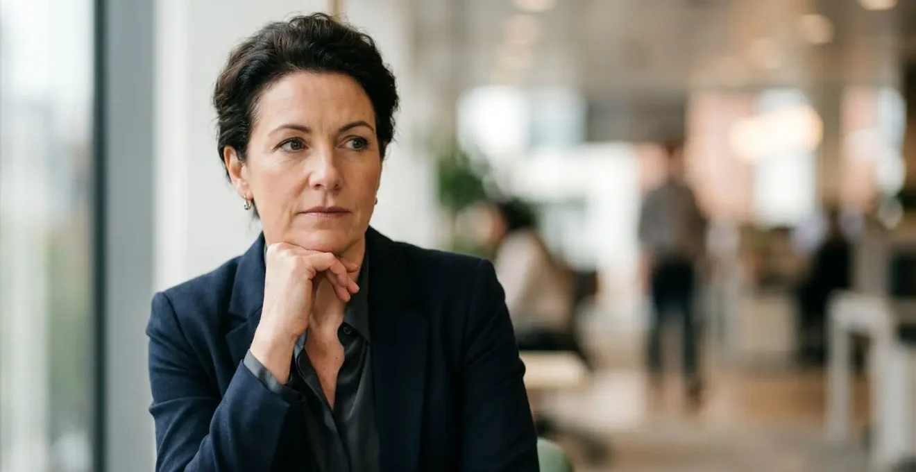 Human-centered photograph showing business leadership contemplating strategic change